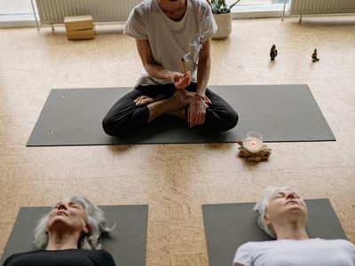 Calm yoga space with a mat and incense.